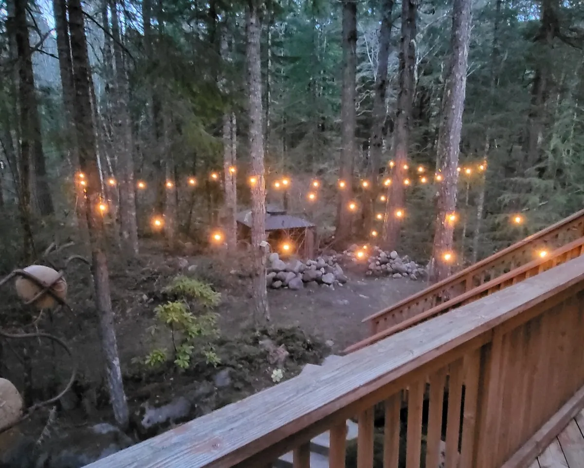 Lost Shelter Chalet outdoor firepit under string lights